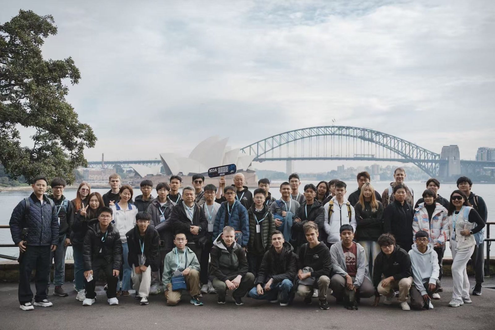 ICOA 2026 competitors in front of the Sydney Opera House and Harbour Bridge
